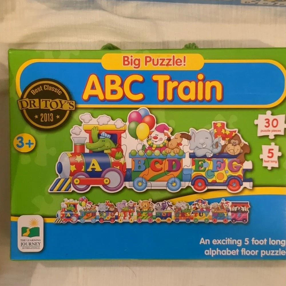 The learning journey puzzle bundle of 4 numbers, letters, people, train